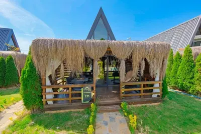 a gazebo in a yard with at Kerpe Bungalov Hotel in Kocaeli