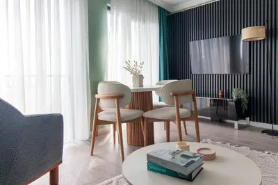 a living room with a table and two chairs at Modern & Stylish 2BR Haven by the Sea in Yedikule in Istanbul
