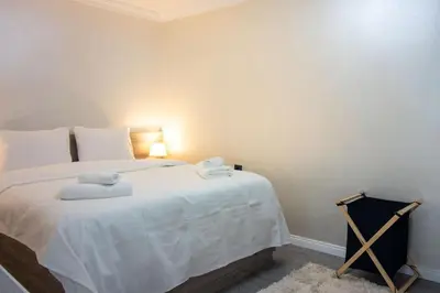a bedroom with a large white bed with towels on it at Classy 2BR Hideaway with Dazzling Panorama in Istanbul