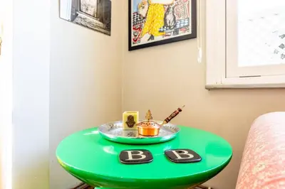 a green table with a b sign on it at Historic Balat 2BD2Bath Central House! #388 in Istanbul