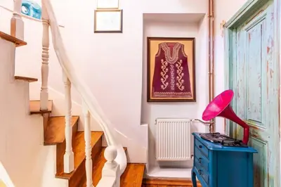 a staircase with a blue dresser and a red lamp at Historic Balat 2BD2Bath Central House! #388 in Istanbul