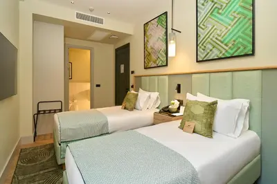 a hotel room with two beds in a room at The Wings Hotels Pera in Istanbul