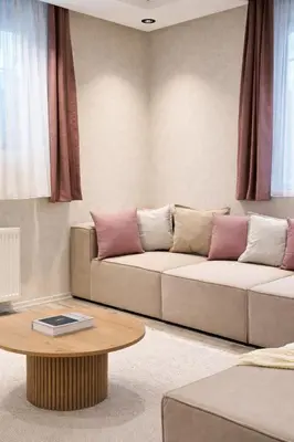 a living room with a couch and a table at Excellent Apartments Pierre Loti in Istanbul