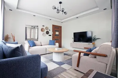 a living room with two couches and a tv at Excellent Apartments Pierre Loti in Istanbul