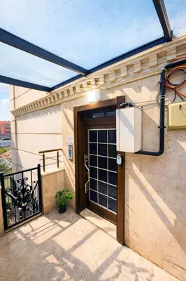 a glass door on a building with a balcony at Excellent Apartments Pierre Loti in Istanbul