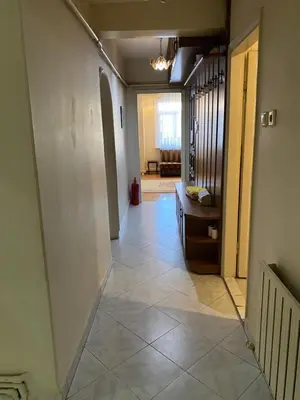 a hallway with a tile floor in a room at Spacious apartment very close to the tram in Istanbul