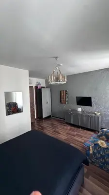 a living room with a bed and a couch at Echoloft İstanbul- Nişantaşı in Istanbul