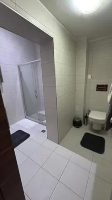 a bathroom with a shower and a toilet at Echoloft İstanbul- Nişantaşı in Istanbul
