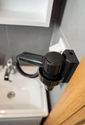 a black microphone is attached to a wall at House with balcony in Galata 2 in Istanbul