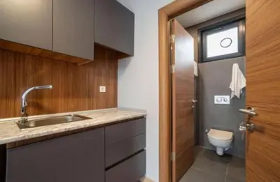 a small bathroom with a sink and a toilet at House with balcony in Galata 2 in Istanbul