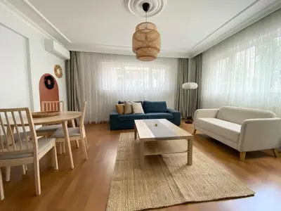 a living room with a blue couch and a table at Near Nişantasi & Stylish No1 in Istanbul