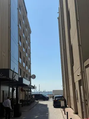 an empty city street with buildings and cars on it at Mandala Karaköy Hotel in Istanbul