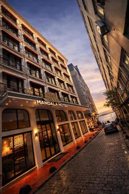 a building on a street in front of a building at Mandala Karaköy Hotel in Istanbul