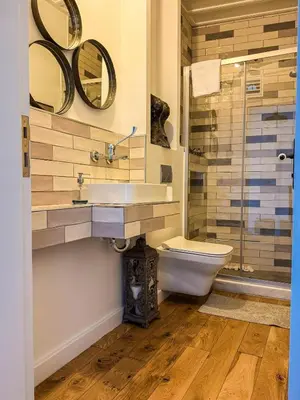 a bathroom with a sink and a toilet and a shower at Sel Maison in Istanbul