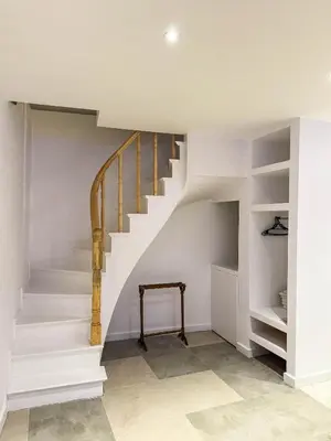 a staircase in a home with white walls at Sel Maison in Istanbul