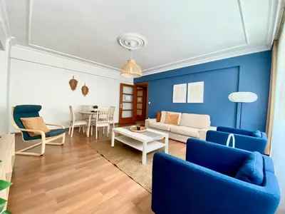 a living room with blue walls and blue furniture at City Center 3 Bedroom Flat - No4 in Istanbul