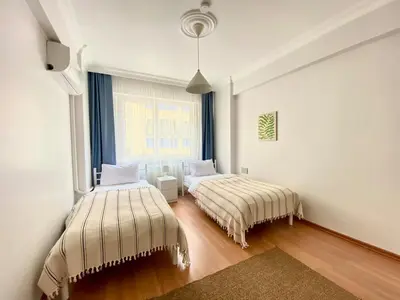 a bedroom with two beds and a window at City Center 3 Bedroom Flat - No4 in Istanbul