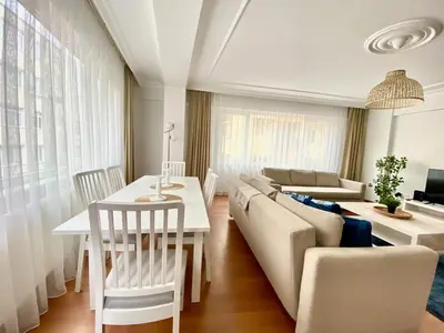 a living room with a couch and a table at Central & Spacious Flat - No5 in Istanbul