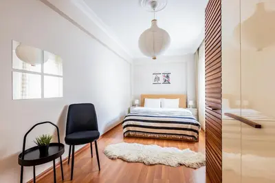 a bedroom with a bed and a desk and a chair at Gorgeous 3 Bedroom Flat - No8 in Istanbul