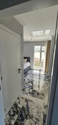 a room with a room with a bed and a window at Luxury villa with sea and forest view in Döngel