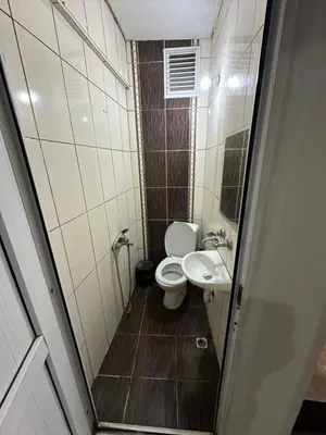 a small bathroom with a toilet and a sink at Şebnem Hotel in Istanbul