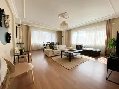a living room with a couch and a table at City Center Spacious Flat No9 in Istanbul