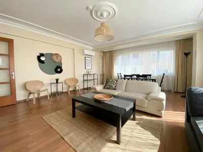 a living room with a couch and a table at City Center Spacious Flat No9 in Istanbul