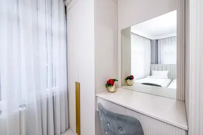 a bedroom with a mirror and a bed at Bright Apart Hotel in Istanbul