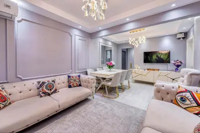 a living room with a couch and a dining room at Bright Apart Hotel in Istanbul