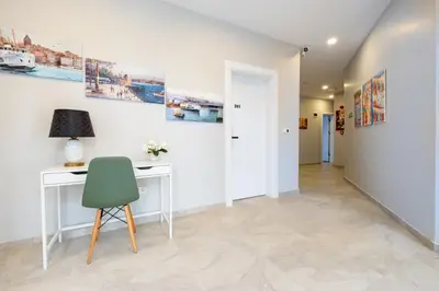 a room with a desk and a green chair at The Han YK Hotel in Avcılar