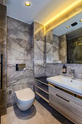 a bathroom with a toilet and a sink at Felix Hotel in Istanbul