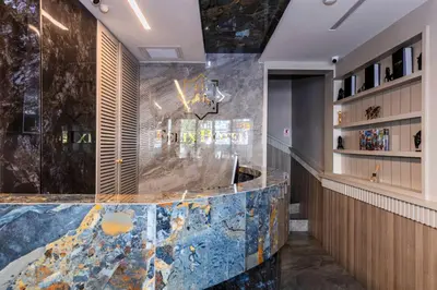 a bar in a restaurant with a blue marble counter at Felix Hotel in Istanbul