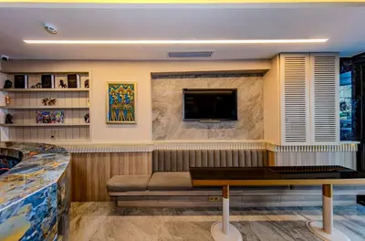 a room with a couch and a tv on a wall at Felix Hotel in Istanbul
