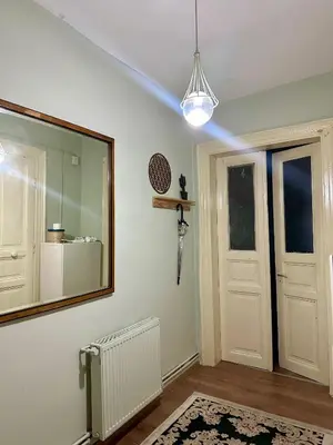 a mirror on a wall next to a door at Hostel Nelly in Istanbul
