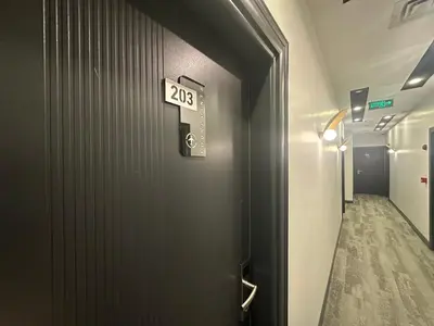 a door with a sign that says on it at Fourpoints Airport Hotel in Arnavutköy