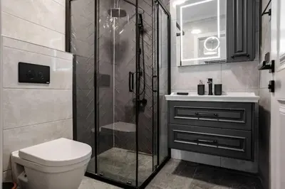 a bathroom with a shower and a toilet and a sink at Boho-Chic 1BR in Firuzaga - Near Galata in Istanbul