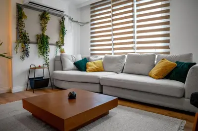a living room with a couch and a coffee table at Forest Inspired Designed 1BR Luxury Flat In Tomtom in Istanbul