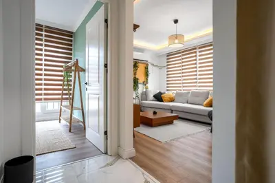 a living room with a couch and a table at Forest Inspired Designed 1BR Luxury Flat In Tomtom in Istanbul