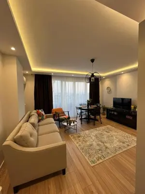 a living room with a couch and a table at Istanbul Bostanci Family Modern Residence with Pool in Istanbul