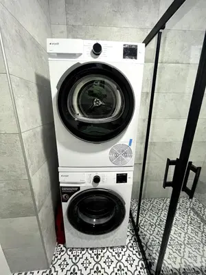 a washer and dryer in a bathroom at Istanbul Bostanci Family Modern Residence with Pool in Istanbul