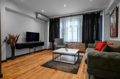 a living room with a couch and a coffee table at Designed 2BR Rooftop Duplex with Private Terrace in Istanbul