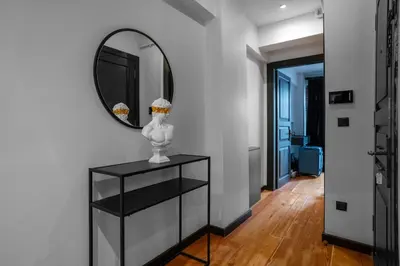 a mirror and a vase on a shelf in a room at Designed 2BR Rooftop Duplex with Private Terrace in Istanbul