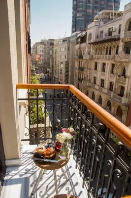 a balcony with a table with food on it at Magnova Studios in Istanbul