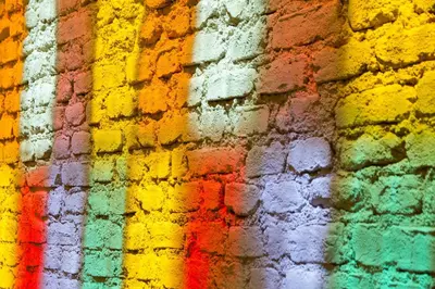 a colorful brick wall with a rainbow at Magnova Studios in Istanbul