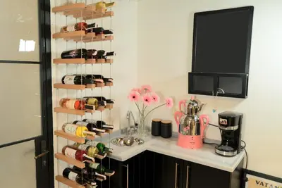 a kitchen with a rack of wine bottles at Magnova Studios in Istanbul