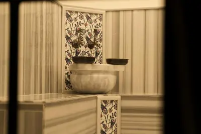 a bowl sitting on a counter in a room with curtains at Magnova Studios in Istanbul