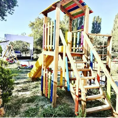 a wooden playground with a wooden play structure at ADASU Otel in Marmara