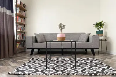 a living room with a couch and a table at charming apt with fast WİFİ and AC near Nişantaşi and Taksim#5 in Istanbul