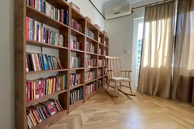 a room with book shelves filled with books at cozy 2BR 2BATH with balcony near to nişantaşi and taksim #4 in Istanbul