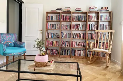 a living room with a book shelf filled with books at cozy 2BR 2BATH with balcony near to nişantaşi and taksim #4 in Istanbul